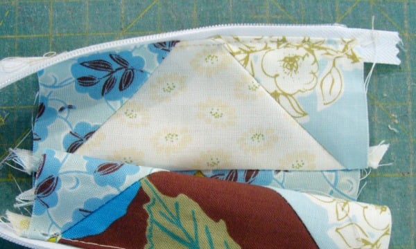 sew the zipper to the top of the quilt block