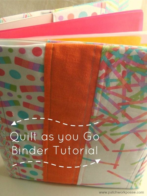 A colorful fabric-covered 3 ring binder cover with polka dot and stripe patterns sits open on a table. Overlay text reads, &ldquo;Quilt as you Go Binder Tutorial.&rdquo; A pink notebook is visible inside the binder.