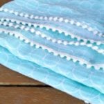 Double Gauze Baby Blanket Tutorial With Pom Poms