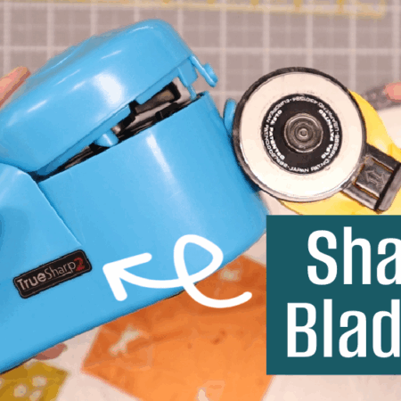 A person holds a blue Rotary Cutter Blade Sharpener and a yellow rotary cutter above colorful fabric, with the text "Sharp Blades!" in a blue box and an arrow pointing to the sharpener. Perfect for any Blade Sharpener Tutorial!.