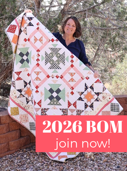 A woman stands outdoors holding a colorful patchwork quilt. A pink banner at the bottom reads "2026 BOM join now!" Shrubs and trees are in the background.