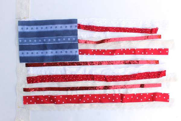 10 Patriotic Flag Projects to Sew Before the 4th of July 9 A handmade American flag crafted with blue, red, and white ribbons featuring stars and polka dots—perfect for Patriotic flag projects or to sew for your 4th of July celebrations. All arranged on a crisp white background.