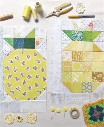 Two pineapple quilt blocks, made from yellow and green fabric pieces, are laid out on a white surface with sewing supplies&mdash;perfect if you want to sew pineapple quilt blocks or learn to sew with a free sewing tutorial.