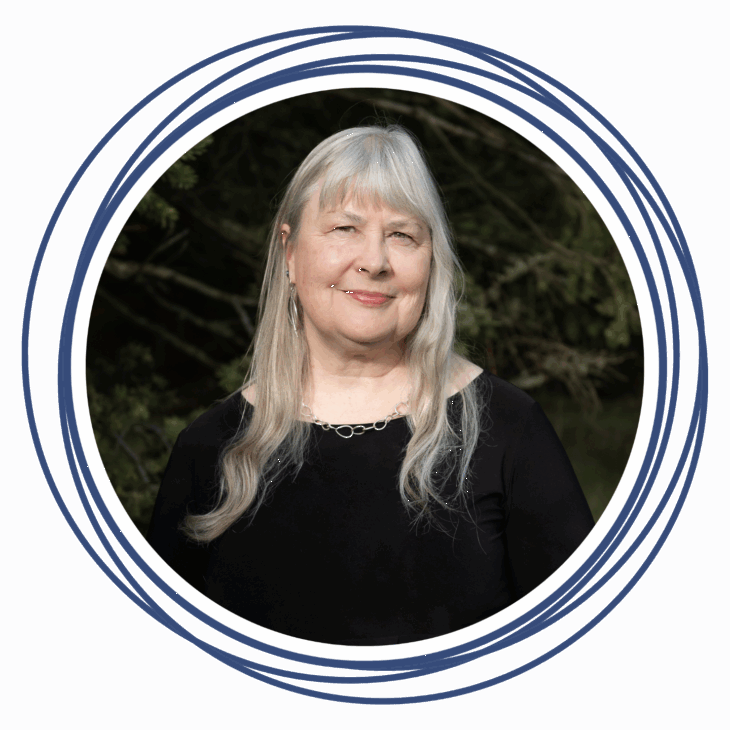 An older woman with long gray hair and a black top smiles gently, standing outdoors in natural light. The photo, framed by overlapping navy blue circles, evokes the warmth of a quilting summit and the inspiration to move the needle forward.