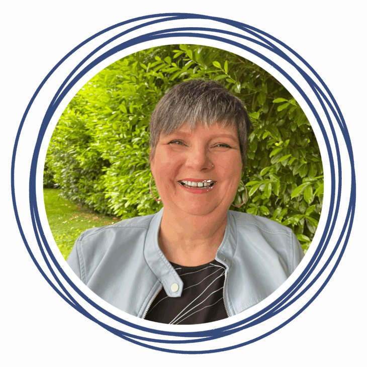A smiling person with short gray hair and a light blue jacket stands in front of green bushes, framed by concentric blue circles on a white background, ready to move the needle at the next quilting summit.