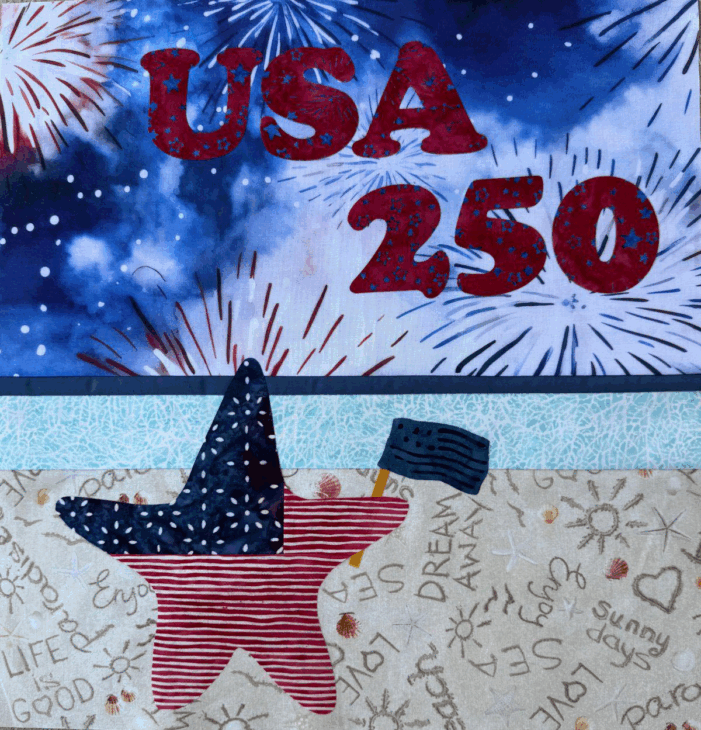 250th Anniversary Pattern Bundle - Limited Time 13 A quilt panel marking the 250th Anniversary features "USA 250" in red letters over fireworks. Below, a red-striped star with a blue, star-spangled hat holds a blue American flag. The background includes words like "life," "good," and "dream away.