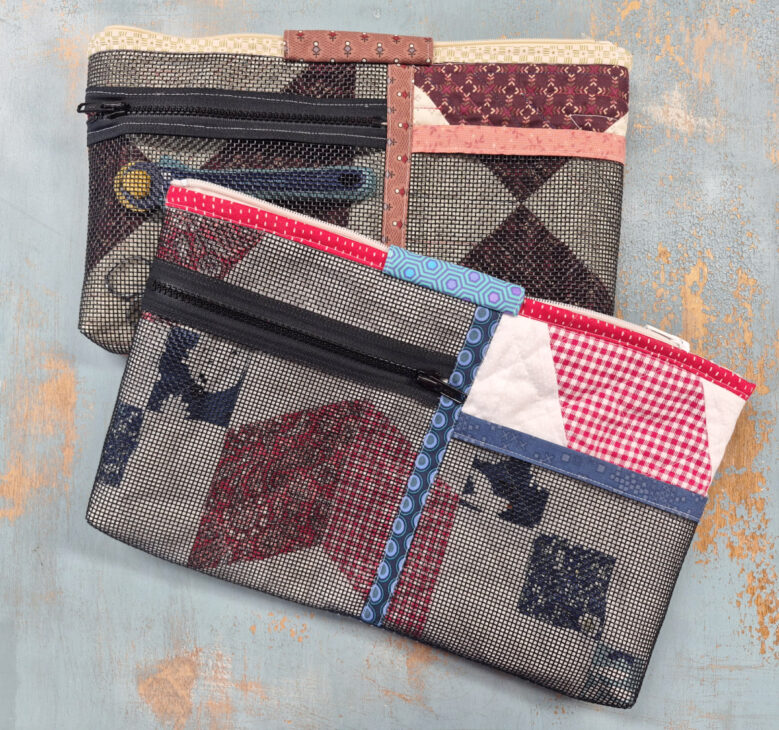 Two zippered fabric pouches with patchwork quilt-style patterns in various colors, perfect as a notion bag for sewing supplies, placed on a textured light blue and tan surface.