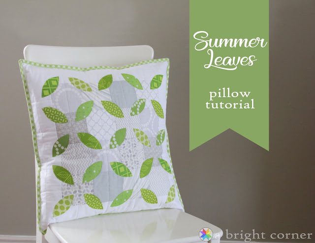 Refresh Your Home with These Summer Pillow Sewing Ideas (free patterns) 8 A white chair holds a square pillow decorated with green leaf patterns. Beside it, a green banner reads "Summer Leaves pillow tutorial," the perfect project for your next summer pillow sewing session and an easy way to give your home refresh just in time for the season.