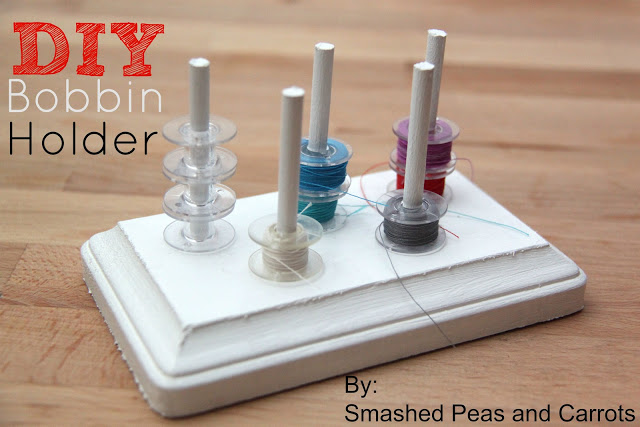 Bobbin Storage Ideas That Will Finally Keep Those Threads Under Control 3 Homemade bobbin holder made from a painted wood block with four upright dowels, each holding several sewing bobbins of different colors—perfect for clever Bobbin storage and creative thread organization. Text reads “DIY Bobbin Holder. By: Smashed Peas and Carrots.”.